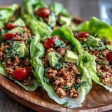 Juicy turkey taco lettuce wraps piled high with fresh toppings, perfect for a light meal.