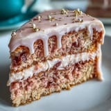 Soft pink rosé velvet cake with decadent cream cheese frosting, ready to slice.