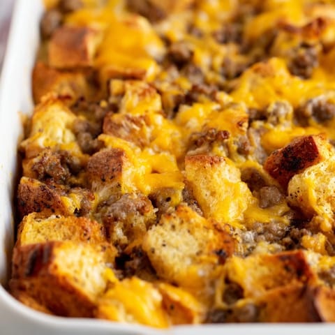 Golden-brown Breakfast Sausage Casserole fresh from the oven, topped with bubbly cheddar and mozzarella cheese.