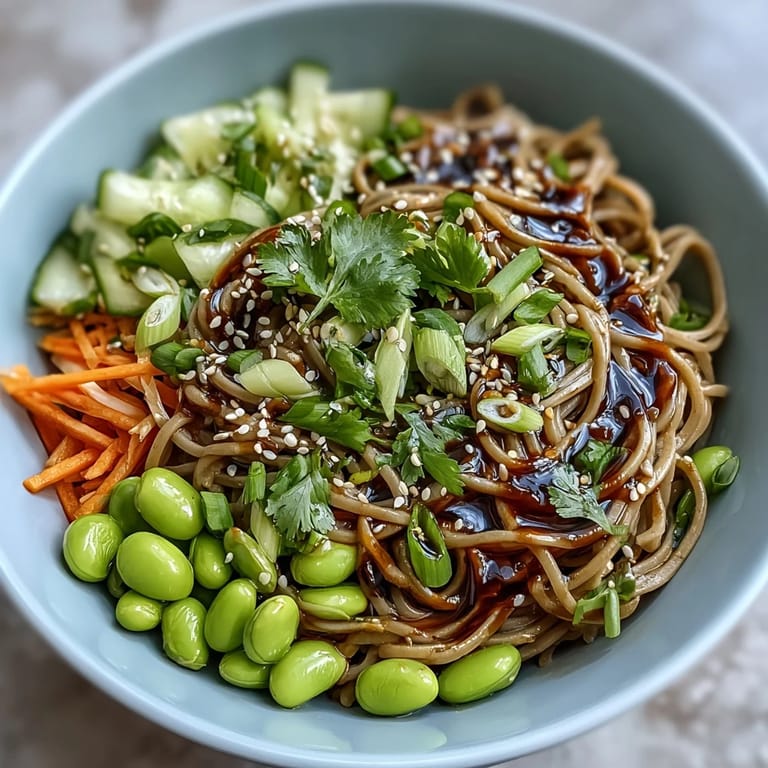 Healthy Japanese Soba Noodle Bowl featuring chewy buckwheat noodles and colorful vegetables, tossed in a creamy sesame dressing for a refreshing dinner.