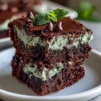 Decadent mint chocolate chip brownie bites, rich and fudgy with bursts of chocolate and cool mint flavor, perfect for St. Patrick's Day celebrations.