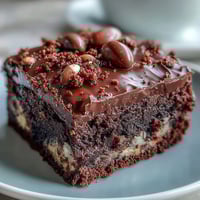 Decadent Cadbury Egg chocolate brownies with a fudgy center and crunchy crumbled topping, perfect for Easter dessert.